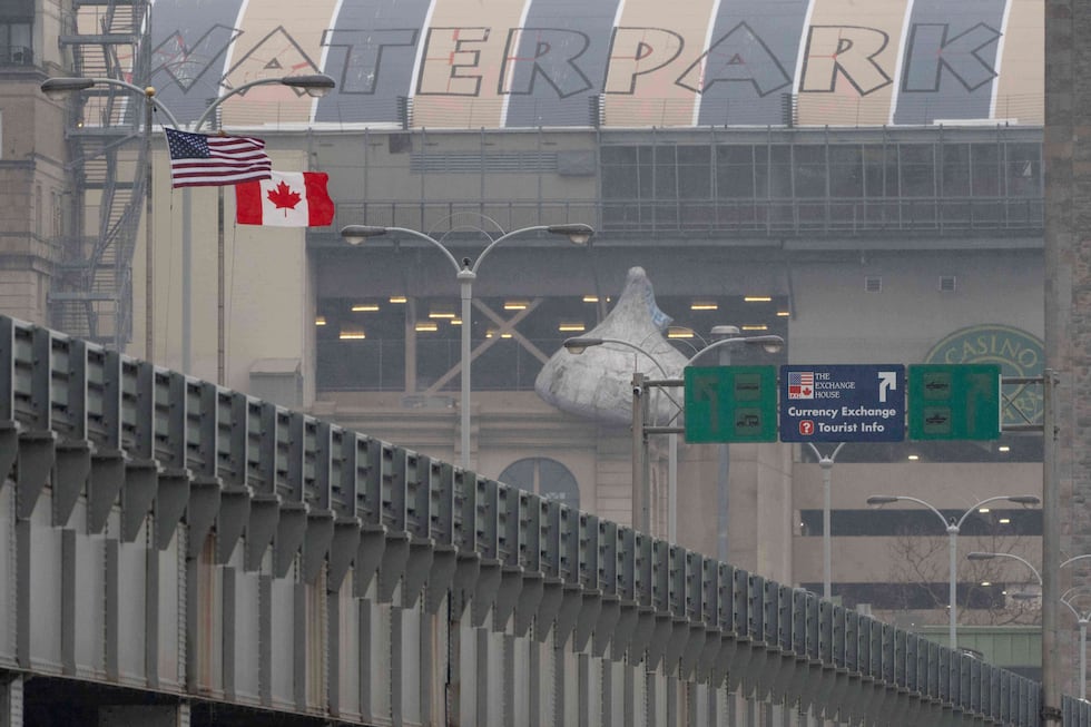 An American flag and Canadian flag are seen on the Rainbow Bridge US-Canada border crossing,...
