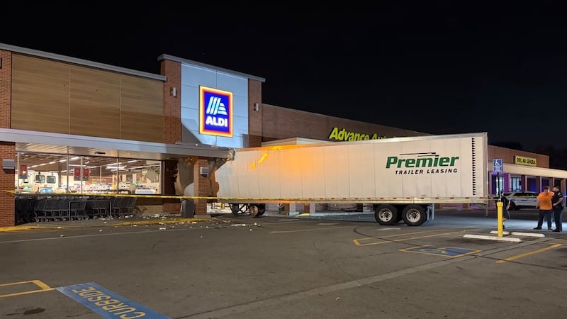 A semi driver is in custody after crashing into an Aldi in East Nashville.