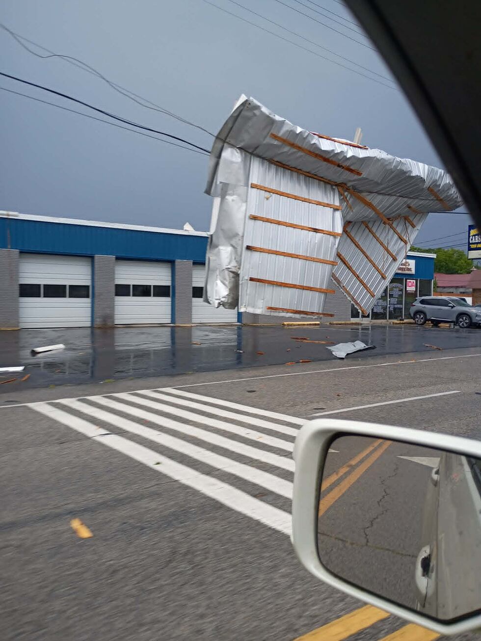 A large piece of metal sheeting was seen wrapped around a power line in Manchester, Tennessee,...