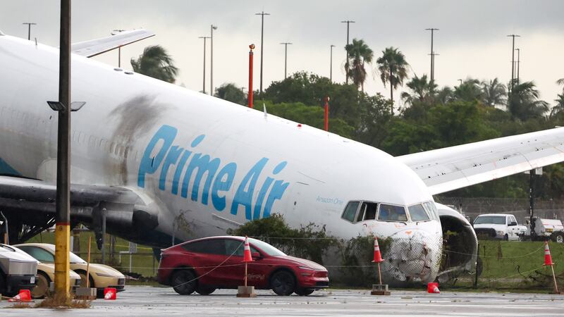 An Amazon cargo plane sits at Miami International Airport after overshooting a runway on...