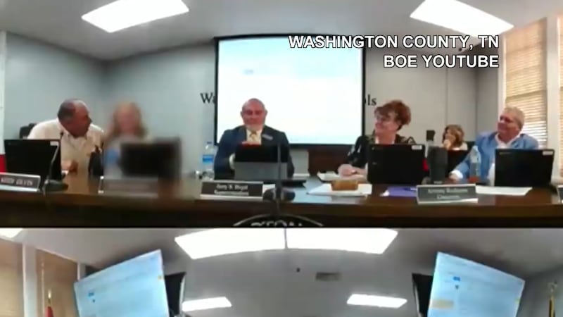 Video from the meeting shows board member Keith Irvin put his arm around the student as he...